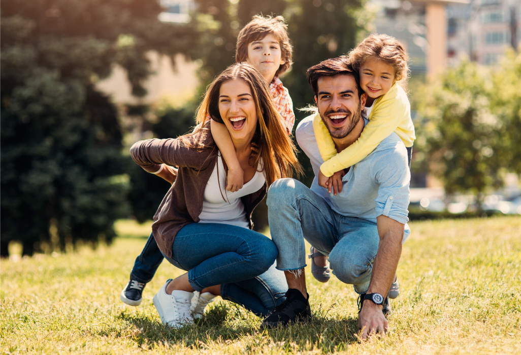 Young family happily playing outdoors