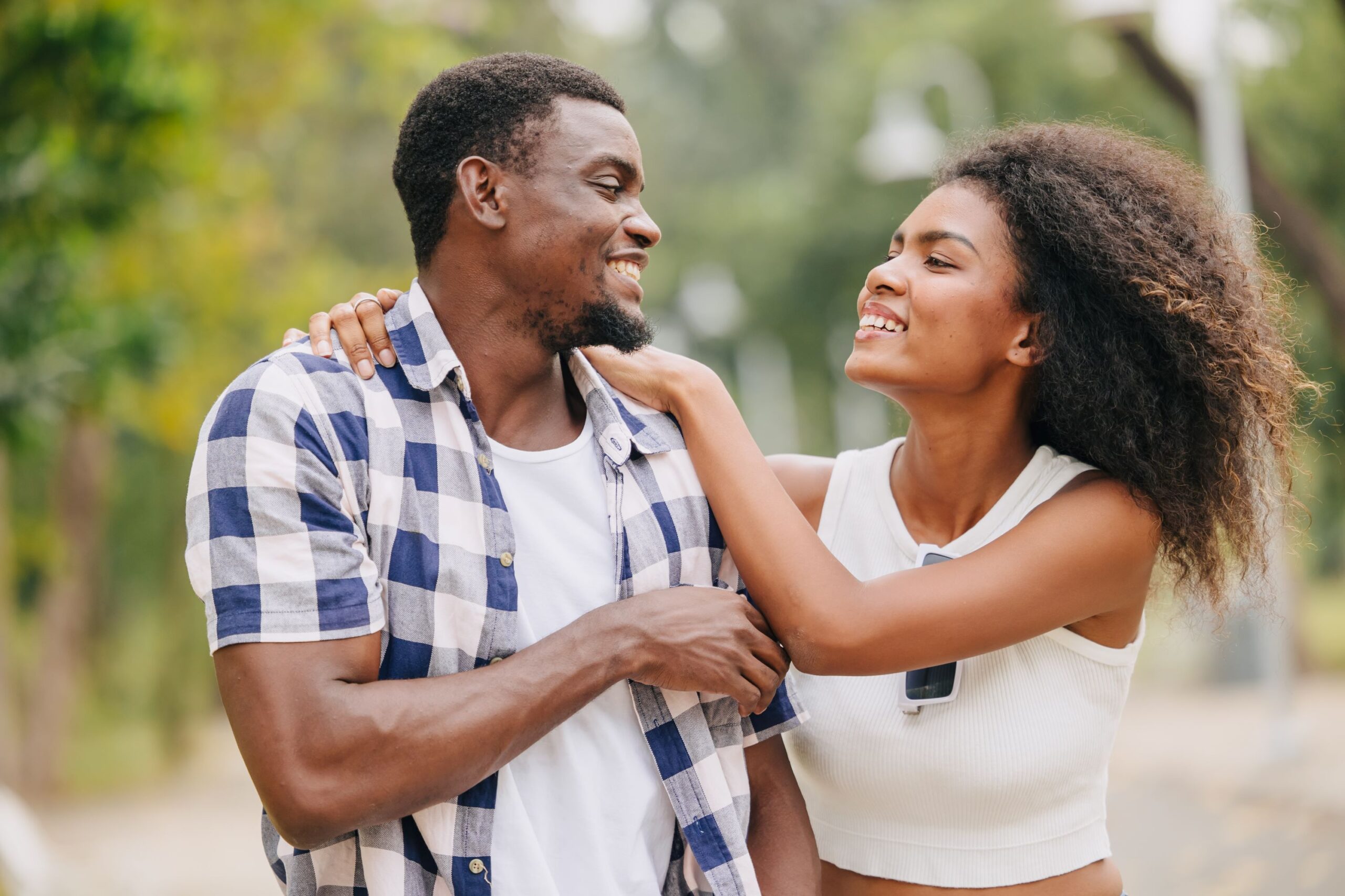 Young African American couple laughing and smiling